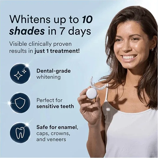 Auraglow Teeth Whitening Kit user holding the LED whitening mouthpiece